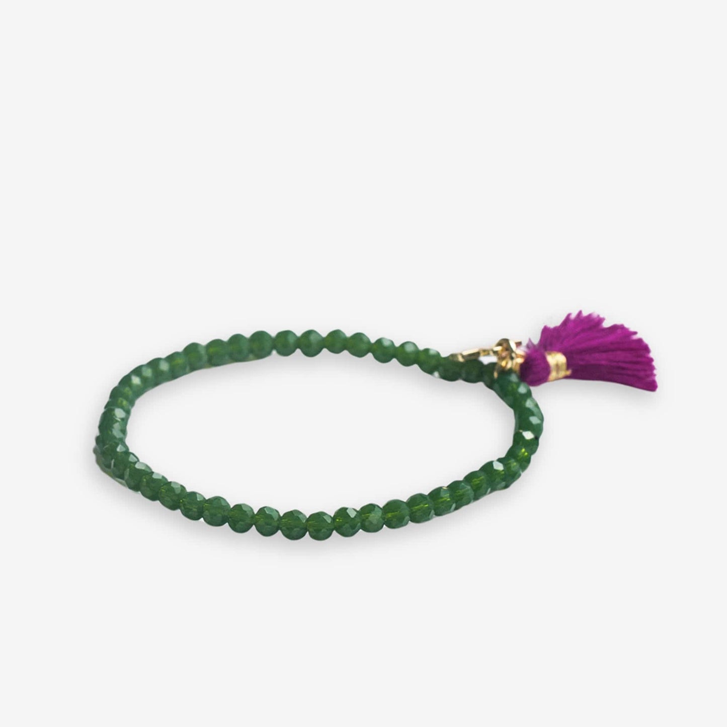 Patsy Solid Crystal Stretch Bracelet With Tassel Emerald