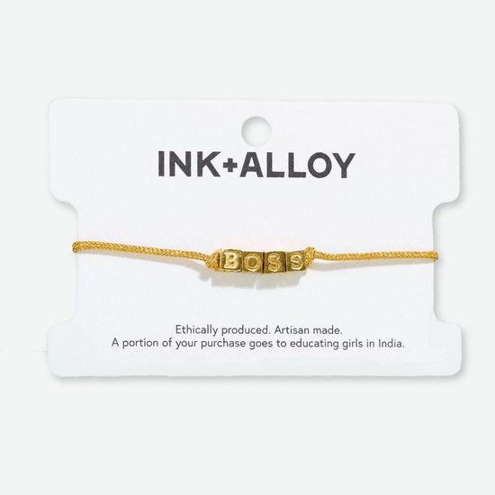 Goldie Gold Lurex Cord With Brass Letters Adjustable Boss Bracelet