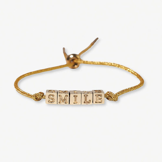 Goldie Gold Lurex Cord With Brass Letters Adjustable Smile Bracelet