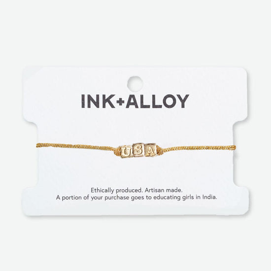 Goldie Gold Lurex Cord with Brass Letters Adjustable USA Bracelet