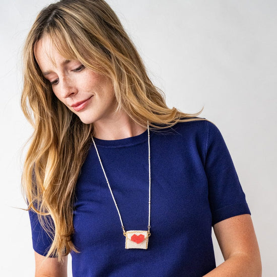 Izzie Pouch Necklace With Red Heart Ivory Pendant