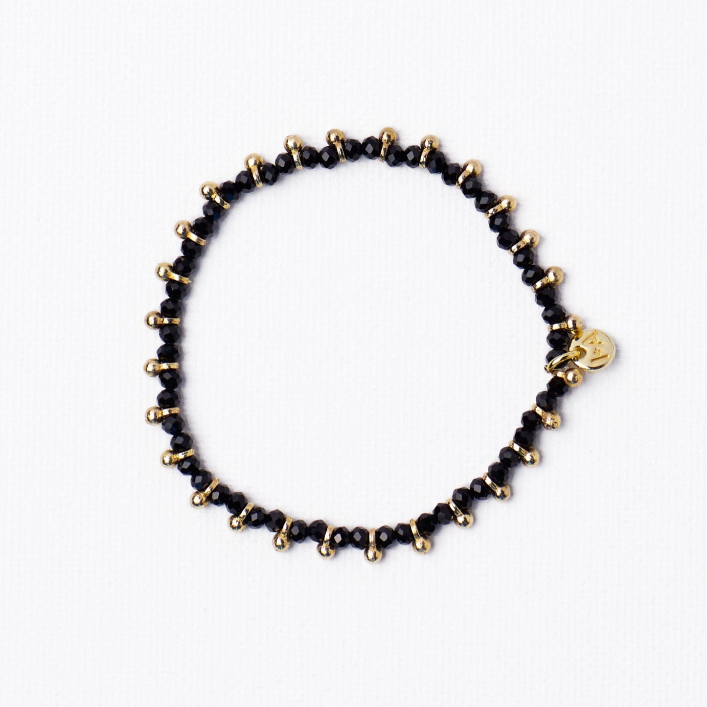 Kami Crystal With Brass Charm Stretch Bracelet Black + Gold Stretch