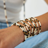 Sage Beaded 10 Strand Stretch Bracelets Gold, Black, + Ivory Stack